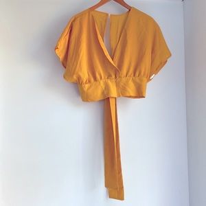 Gold wrap crop shirt with tie back